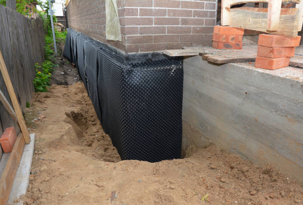 Happy homeowners after waterproofing job in Boone Grove